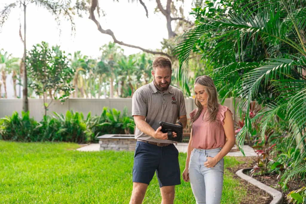 All U Need Pest Control Employee talking with Client