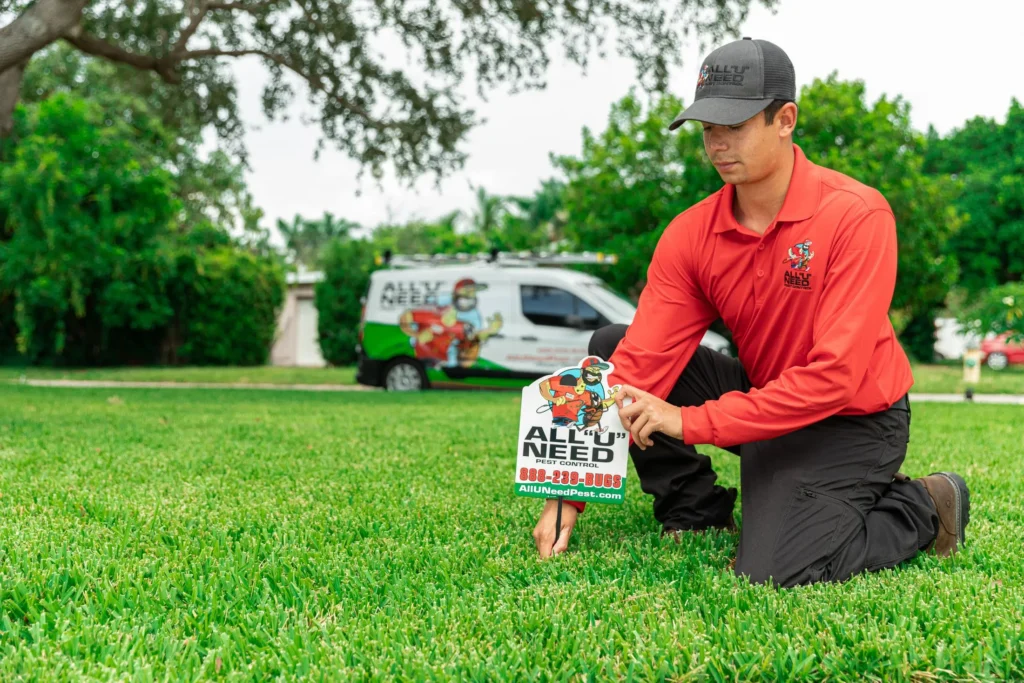 All 'U' Need Pest Control Technician placing sign